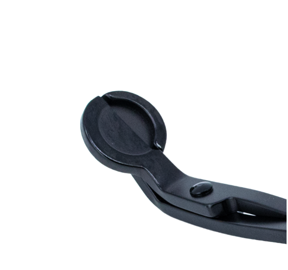 Close-up of matte black candle wick trimmer cutting head
